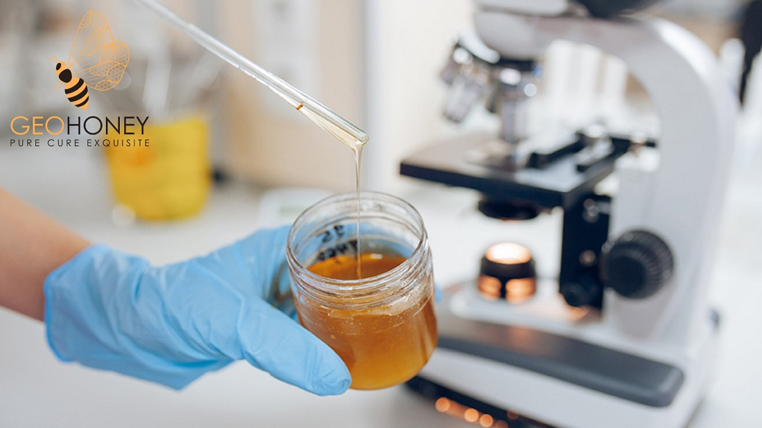 A jar of UK honey being tested in a laboratory. The recent EU fraud investigation found that all tested samples of UK honey failed the authenticity test, raising concerns about the quality and origin of honey produced in the UK.